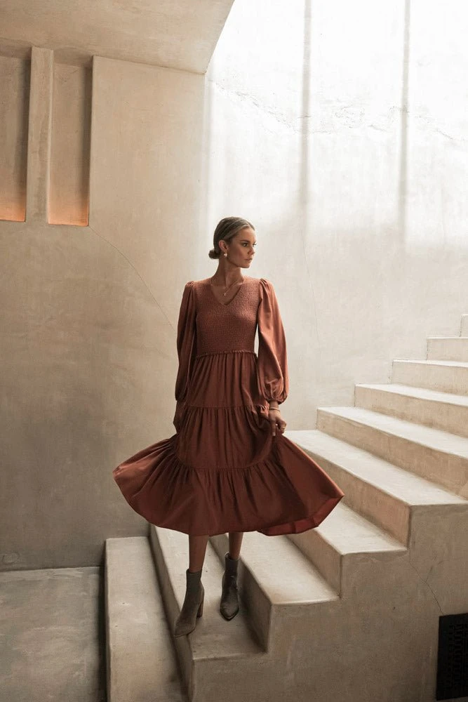 LUMIERE PREORDER - Smocked Tiered Midi Dress In Rust New Arrivals 11 LUMIERE PREORDER - Smocked Tiered Midi Dress In Rust New Arrivals